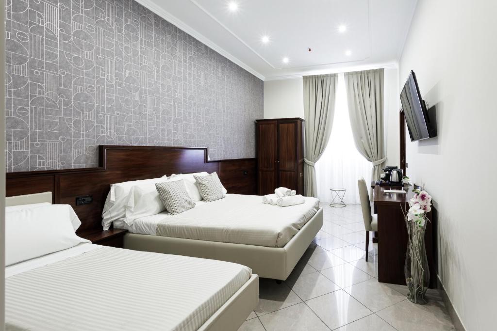 Postel nebo postele na pokoji v ubytování Monti 66 Hotel