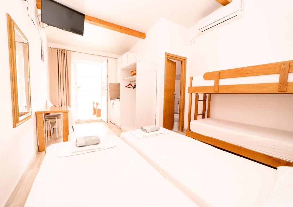 Postel nebo postele na pokoji v ubytování Guesthouse Lastavica