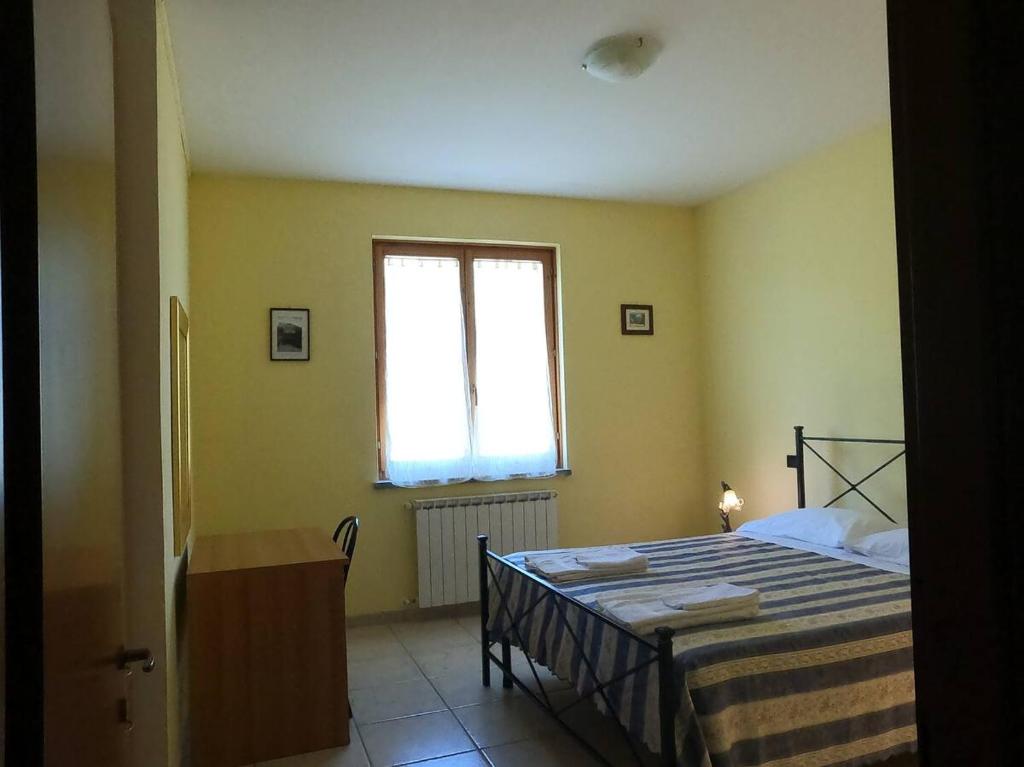 Postel nebo postele na pokoji v ubytování Valle del Poggio