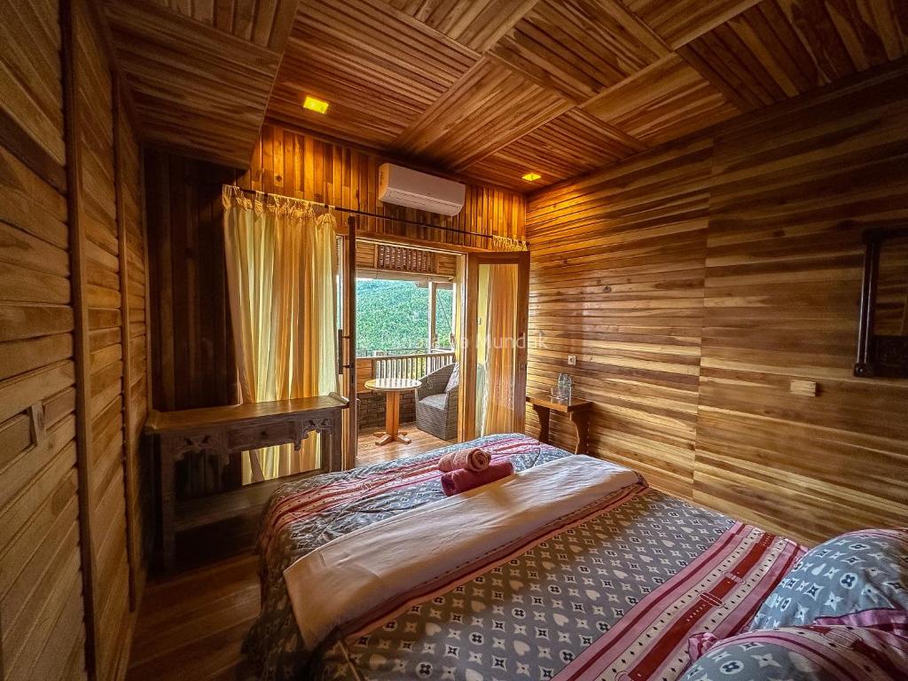 Postel nebo postele na pokoji v ubytování Munduk Panorama