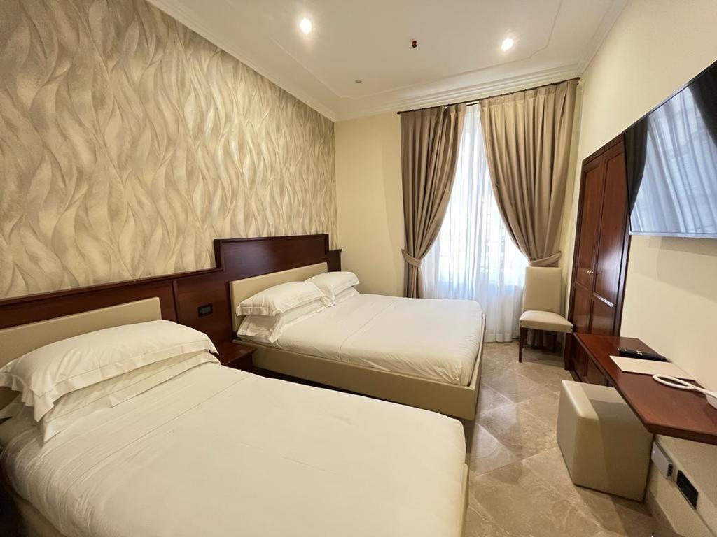 Postel nebo postele na pokoji v ubytování Monti 66 Hotel