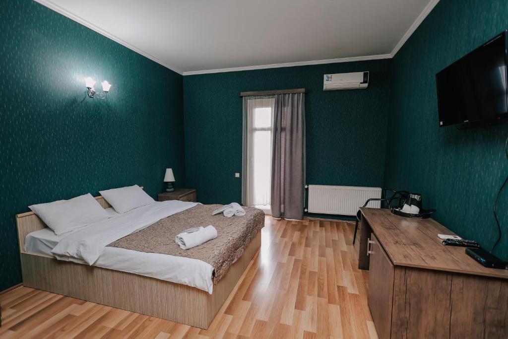 TV a/nebo společenská místnost v ubytování Hotel Darchi