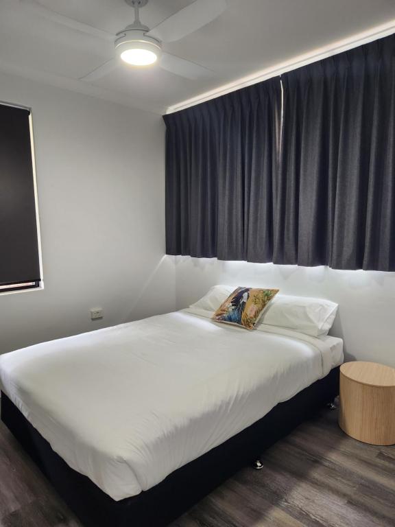 Postel nebo postele na pokoji v ubytování Wambenger Lodge