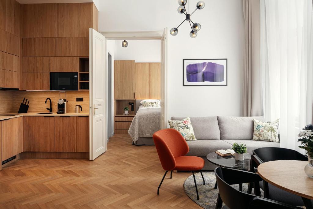 a living room with a couch and a table at R16 Residences Prague in Prague