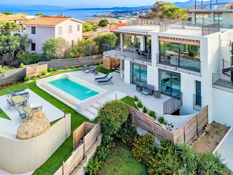 an aerial view of a house with a swimming pool at Villa Mirtillo Golfo Aranci in Golfo Aranci