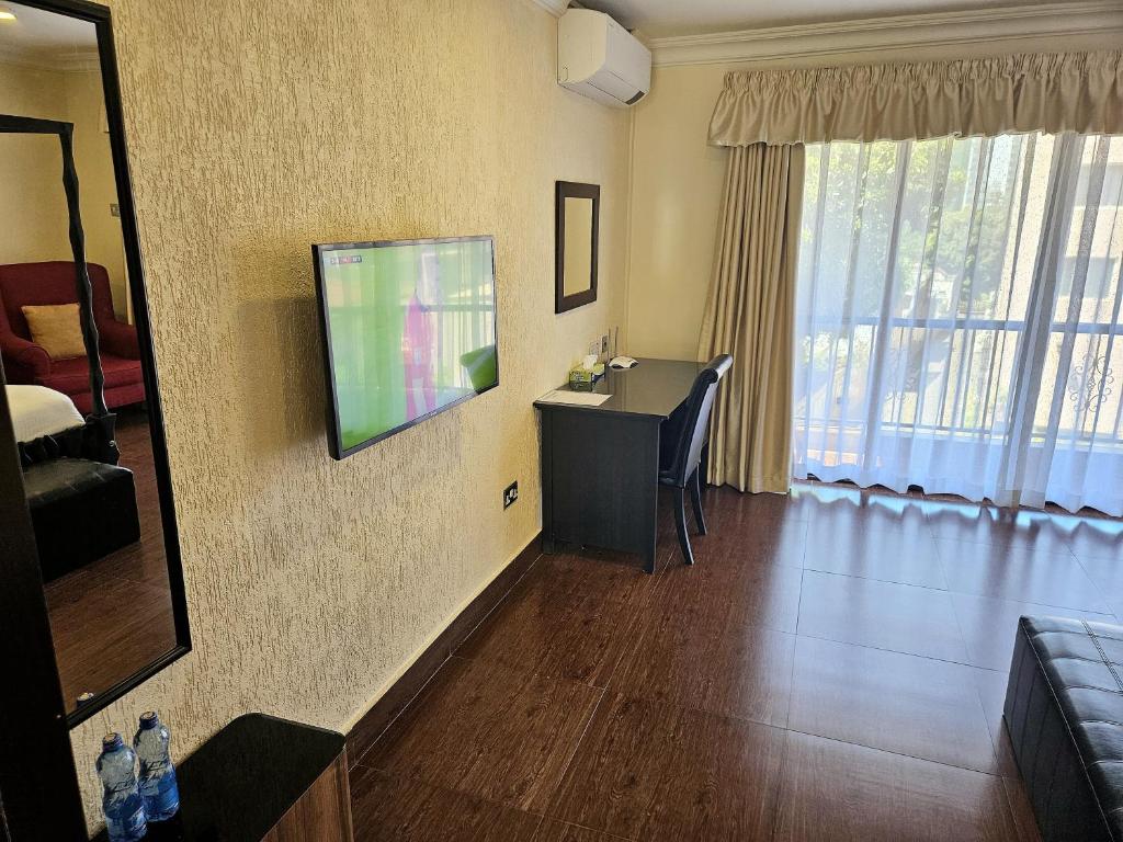 TV a/nebo společenská místnost v ubytování Progressive Park Hotel