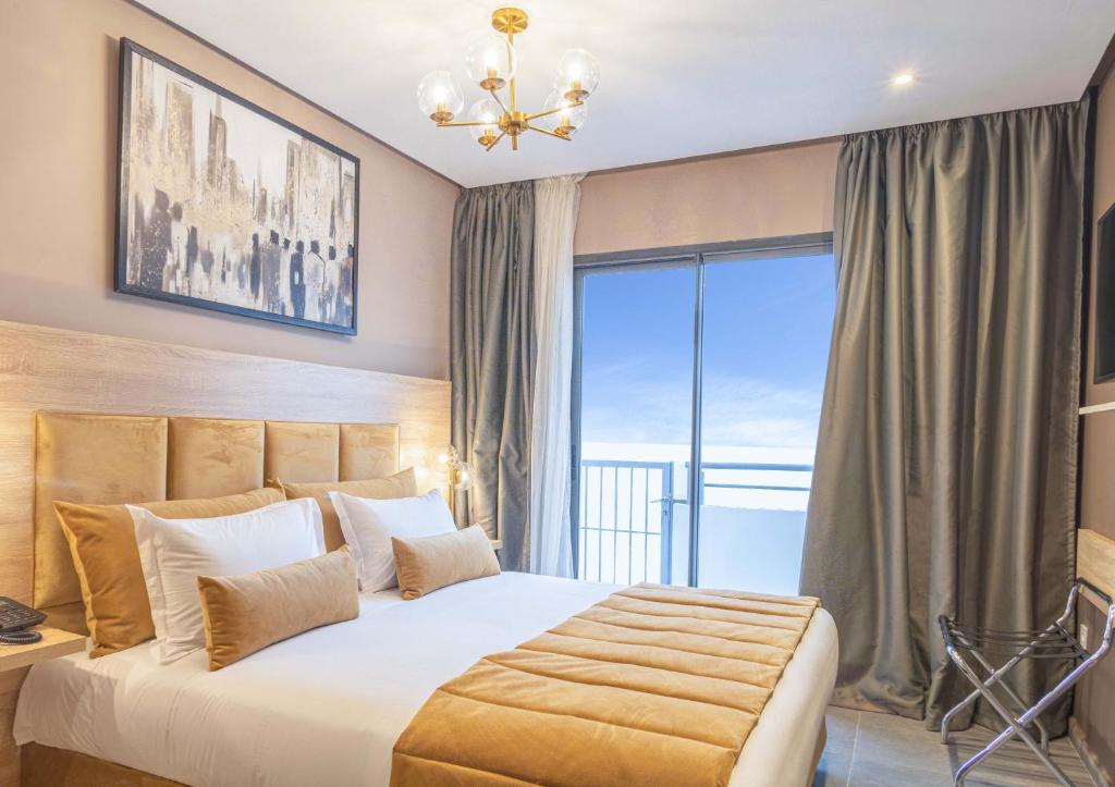 Postel nebo postele na pokoji v ubytování Rent-inn Boutique Hotel