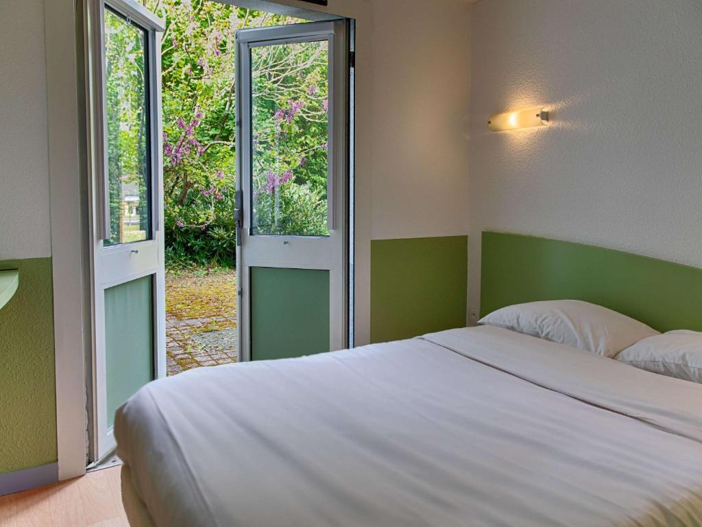 Postel nebo postele na pokoji v ubytování ibis budget Redon