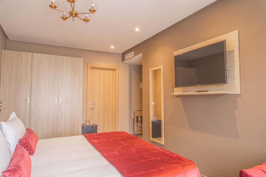 Postel nebo postele na pokoji v ubytování Rent-inn Boutique Hotel
