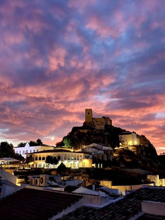 a building on top of a hill with a castle at Luque un pueblo con encanto in Luque
