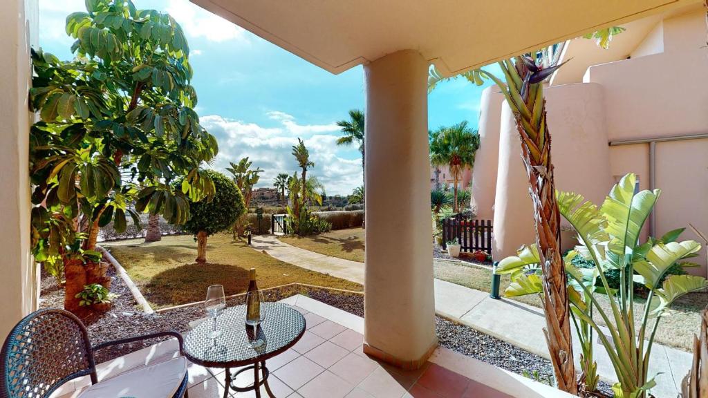 a patio with a table and chairs and trees at Casa Espliego PJ-Murcia Holiday Rentals Property in Torre-Pacheco