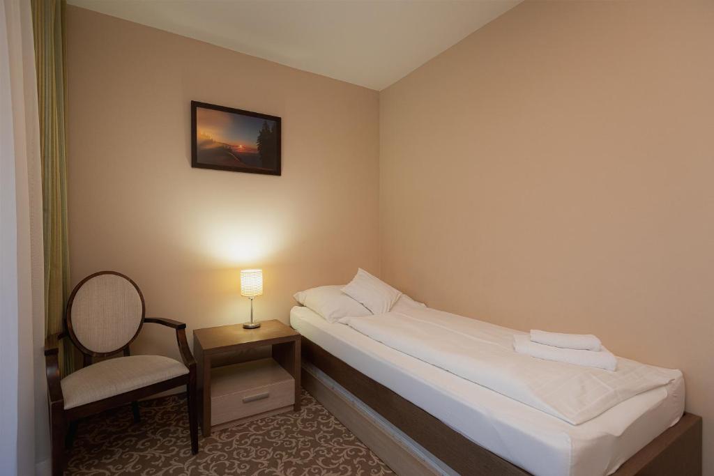 Postel nebo postele na pokoji v ubytování Hotel Green