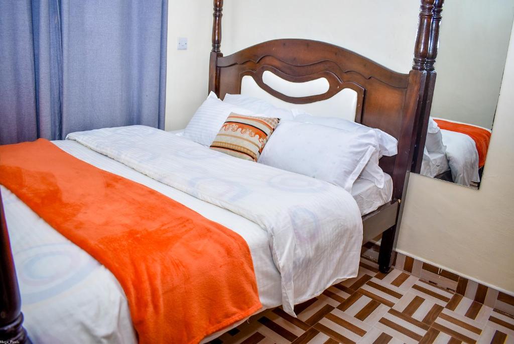 Una cama o camas en una habitación de cosy homes imperial heights