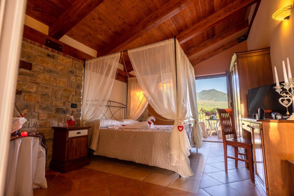 Postel nebo postele na pokoji v ubytování Green Park Bio Agriturismo