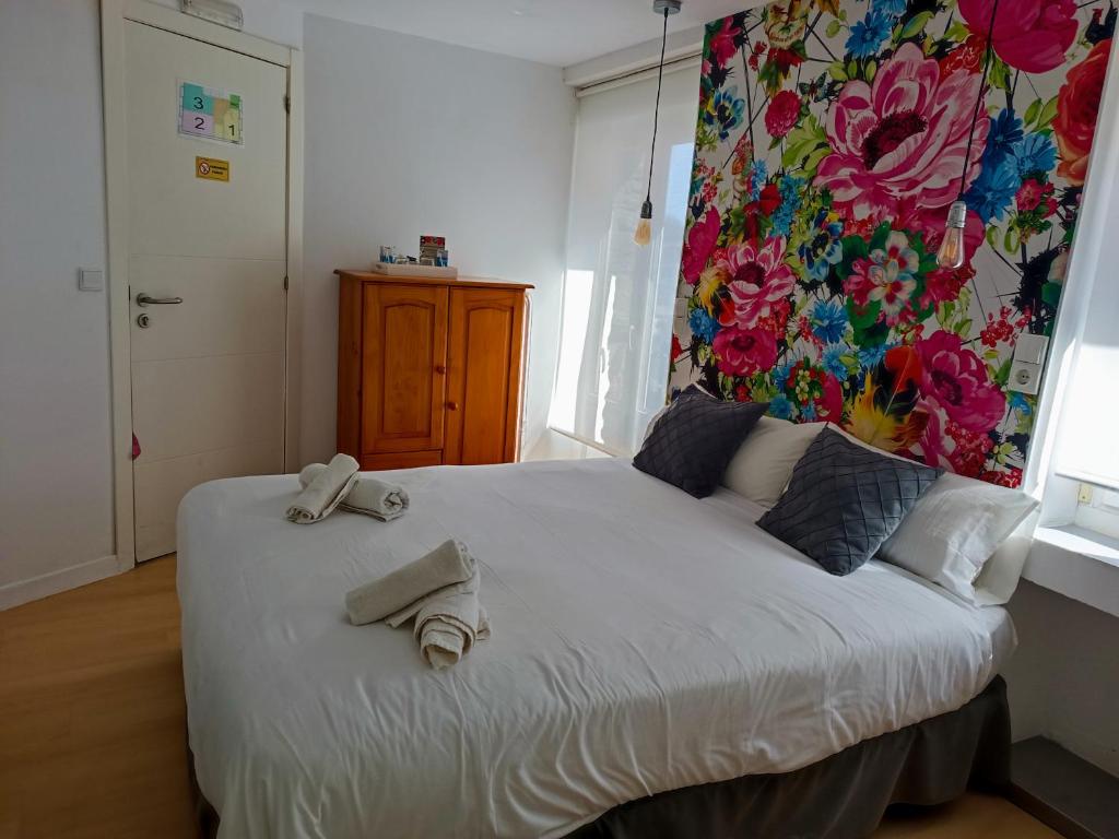 Postel nebo postele na pokoji v ubytování Rin Rooms