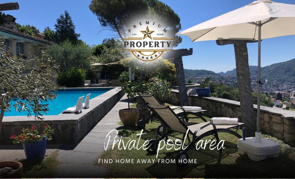 a patio with chairs and an umbrella and a pool at SUITE room with private pool area, near COMO lake, private parking I Villa dei Leoni in Morbio Inferiore