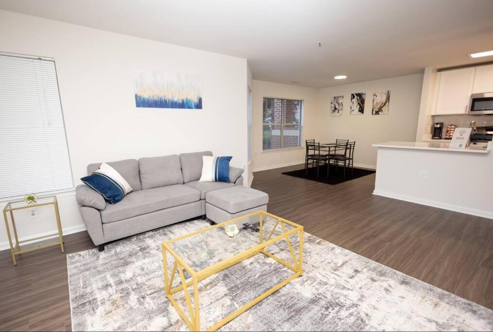 a living room with a couch and a table at Perfect Stay! 1 BR mins to DC in Arlington
