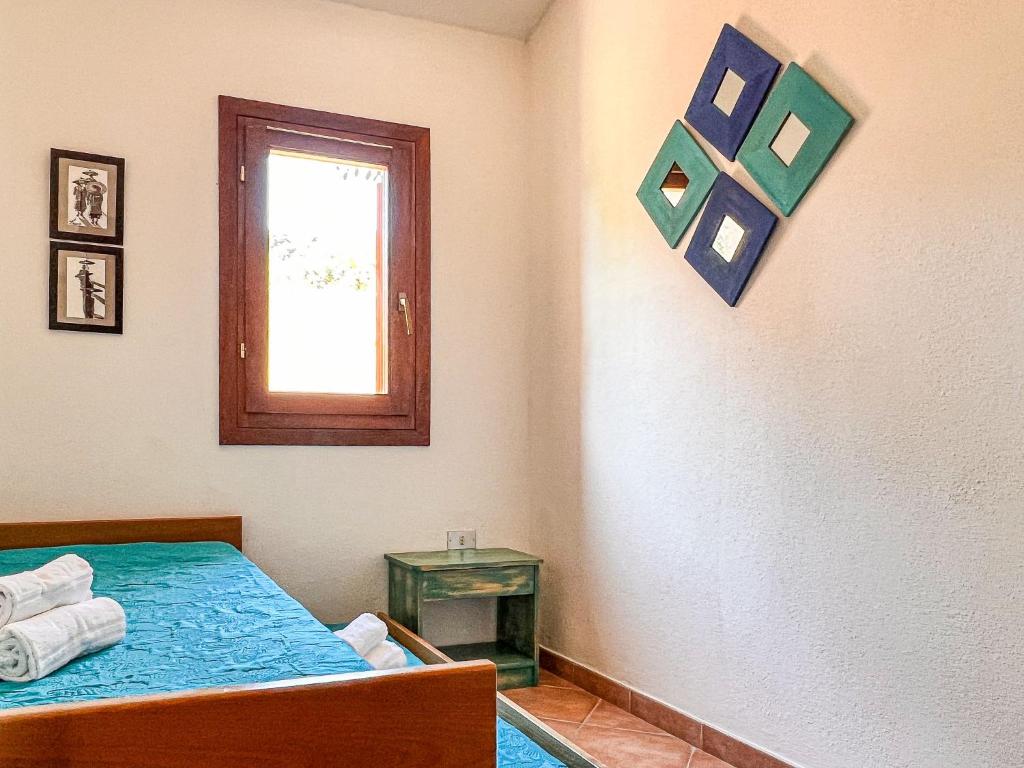 A bed or beds in a room at Villetta Gaia