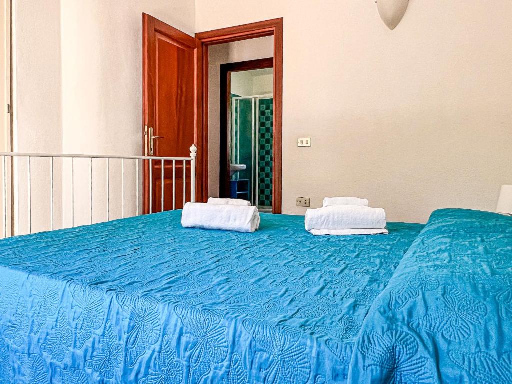 A bed or beds in a room at Villetta Gaia
