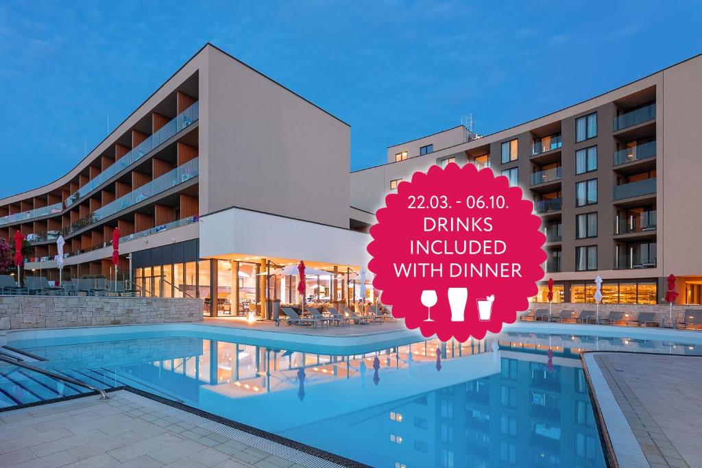 a hotel with a sign that reads drinks included with dinner at Hotel Park Plava Laguna in Poreč