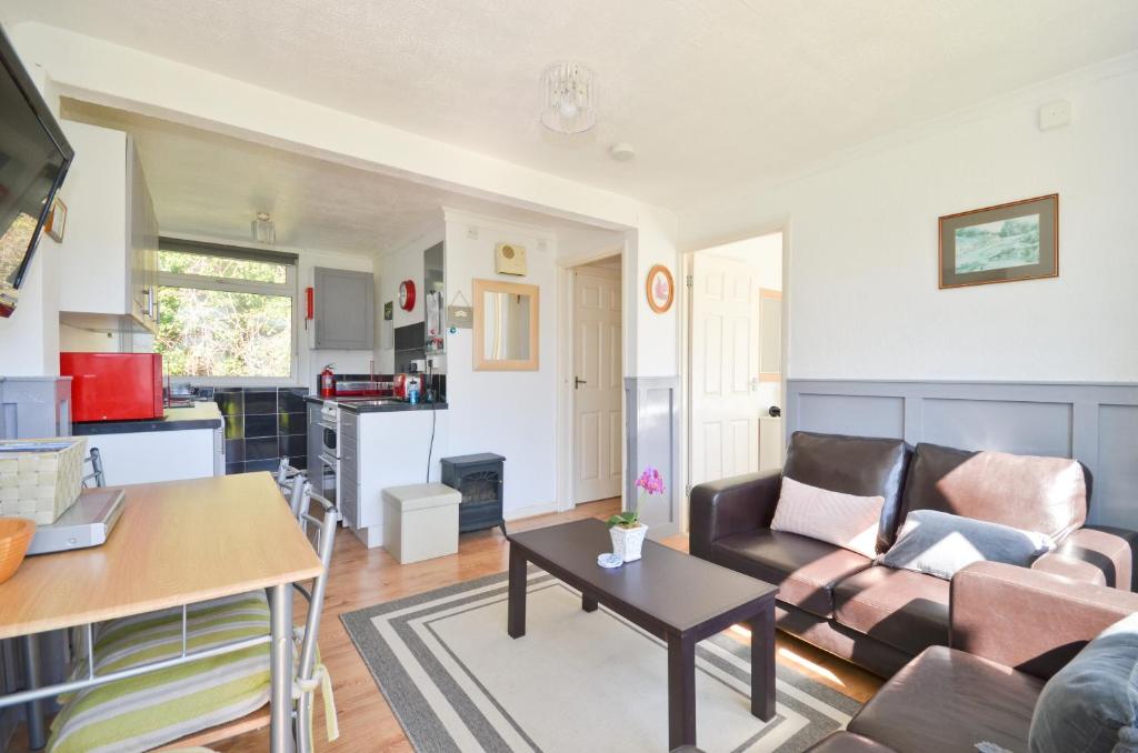 a living room with a couch and a table at 74 Sandown Bay Holiday Park, Isle of Wight in Sandown