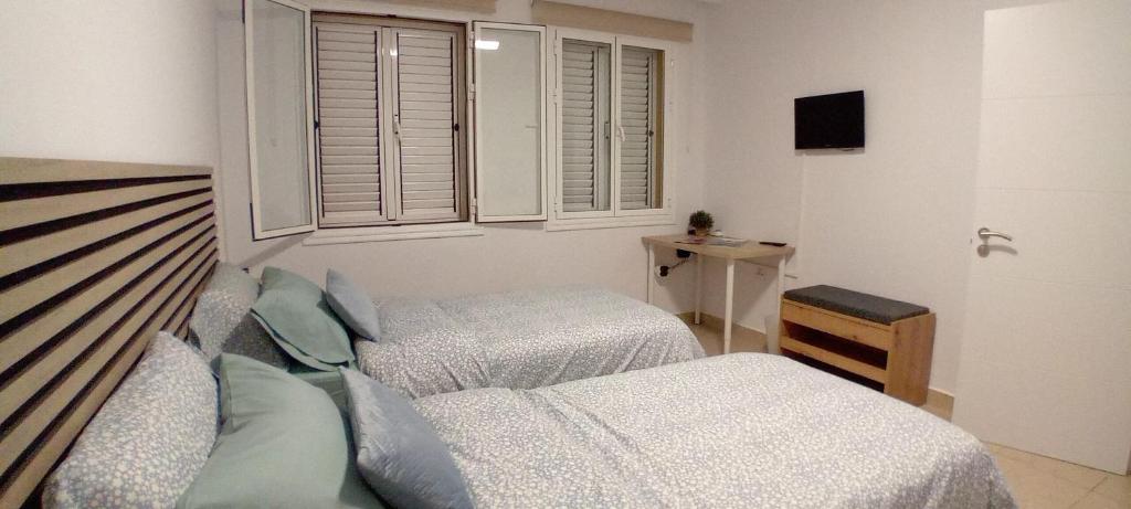 Postel nebo postele na pokoji v ubytování Hoya de Ayala I