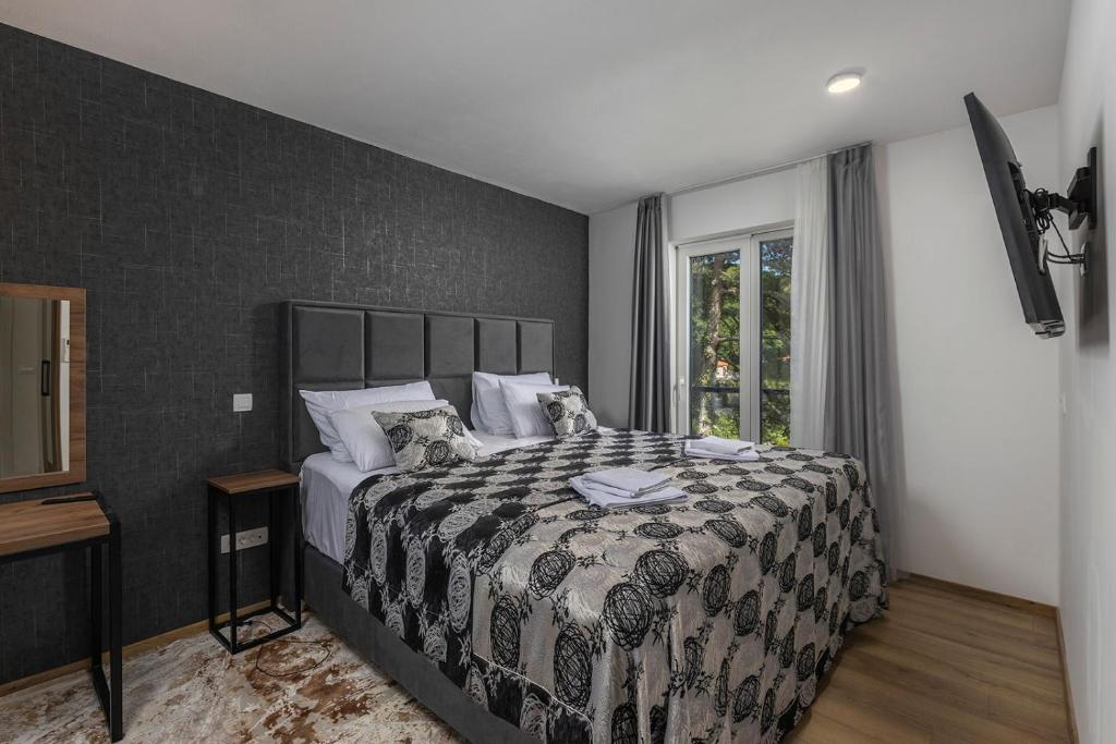 Un pat sau paturi într-o cameră la Villa Visum Mare Tribus