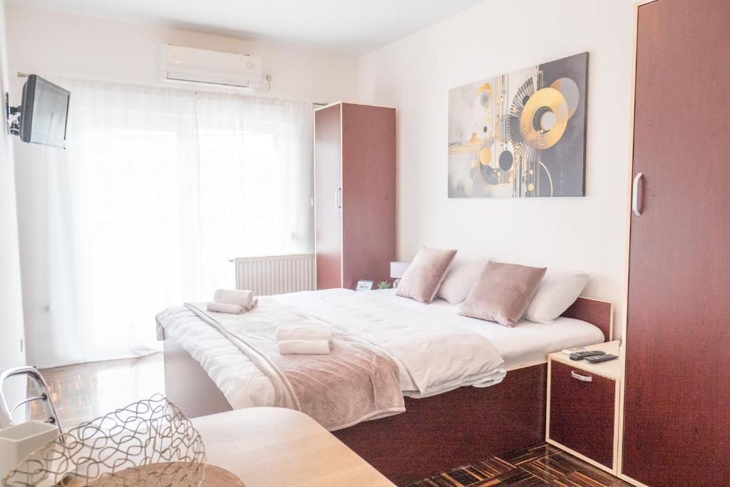 Posteľ alebo postele v izbe v ubytovaní Apartmani Sweet Dream