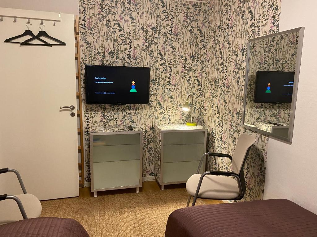 TV a/nebo společenská místnost v ubytování Villa Hygge