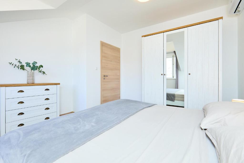Кровать или кровати в номере Apartment 2Home