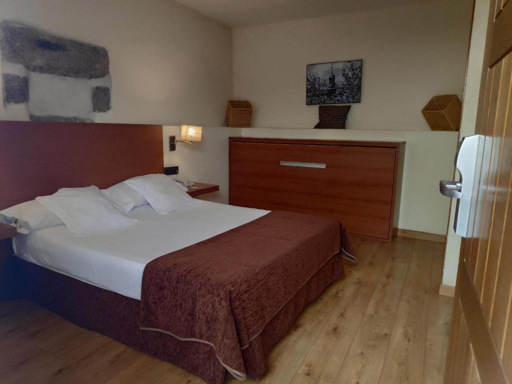 Postel nebo postele na pokoji v ubytování Hotel Las Leyendas