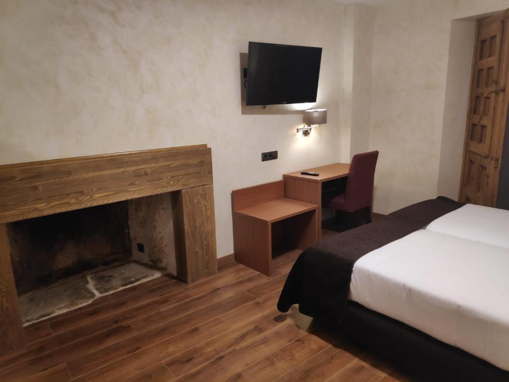Postel nebo postele na pokoji v ubytování Hotel Las Leyendas