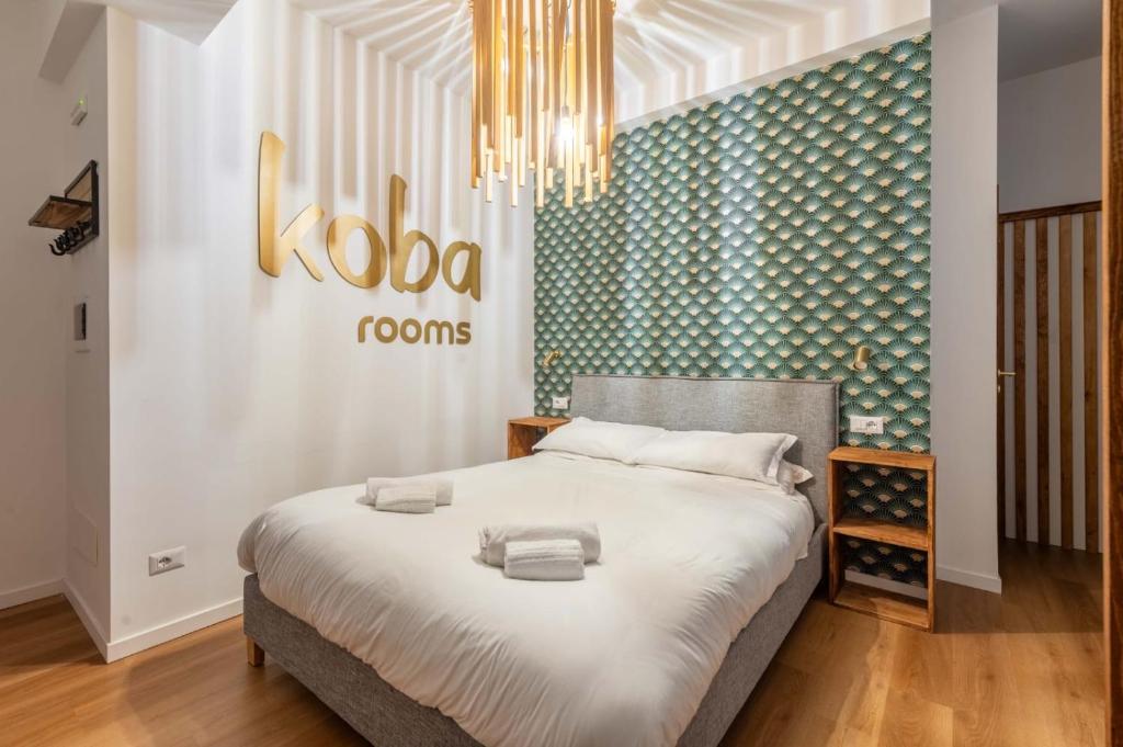 Postel nebo postele na pokoji v ubytování Koba Rooms Nomentano