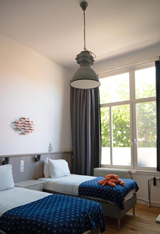 Postel nebo postele na pokoji v ubytování B&B Het Oude Postkantoor