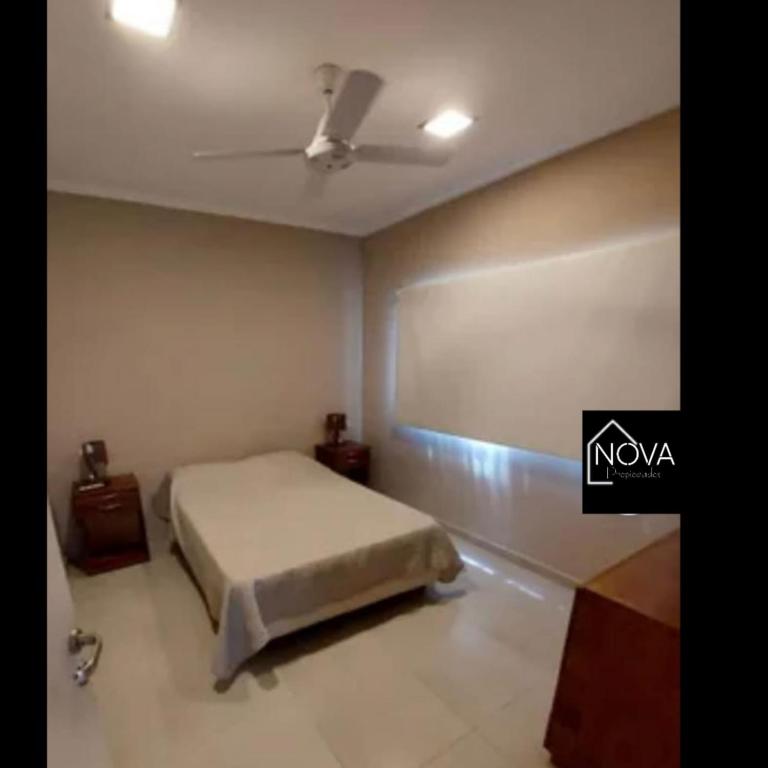 a bedroom with a bed and a ceiling at COMPLEJO E.Y in Paso de la Patria