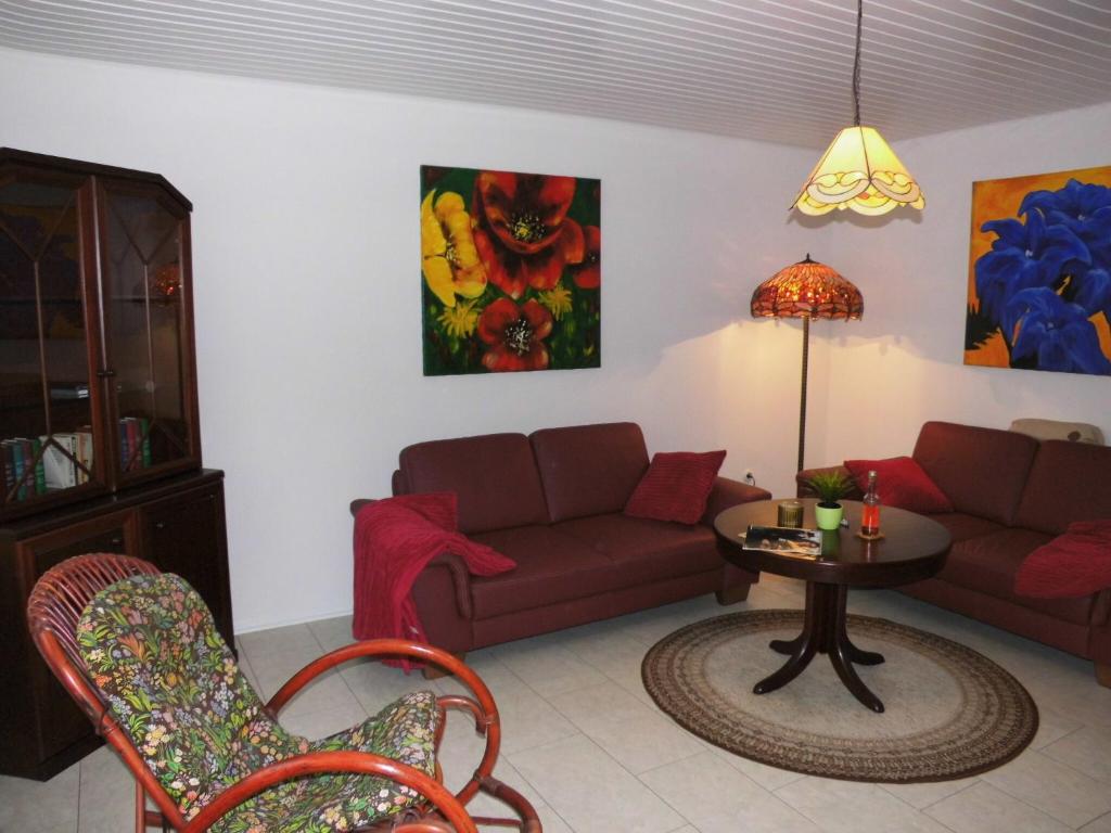 a living room with a couch and a table at Ferienwohnung Tante Martha in Monschau