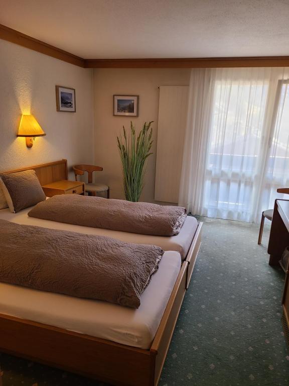 Llit o llits en una habitació de Hotel Residence