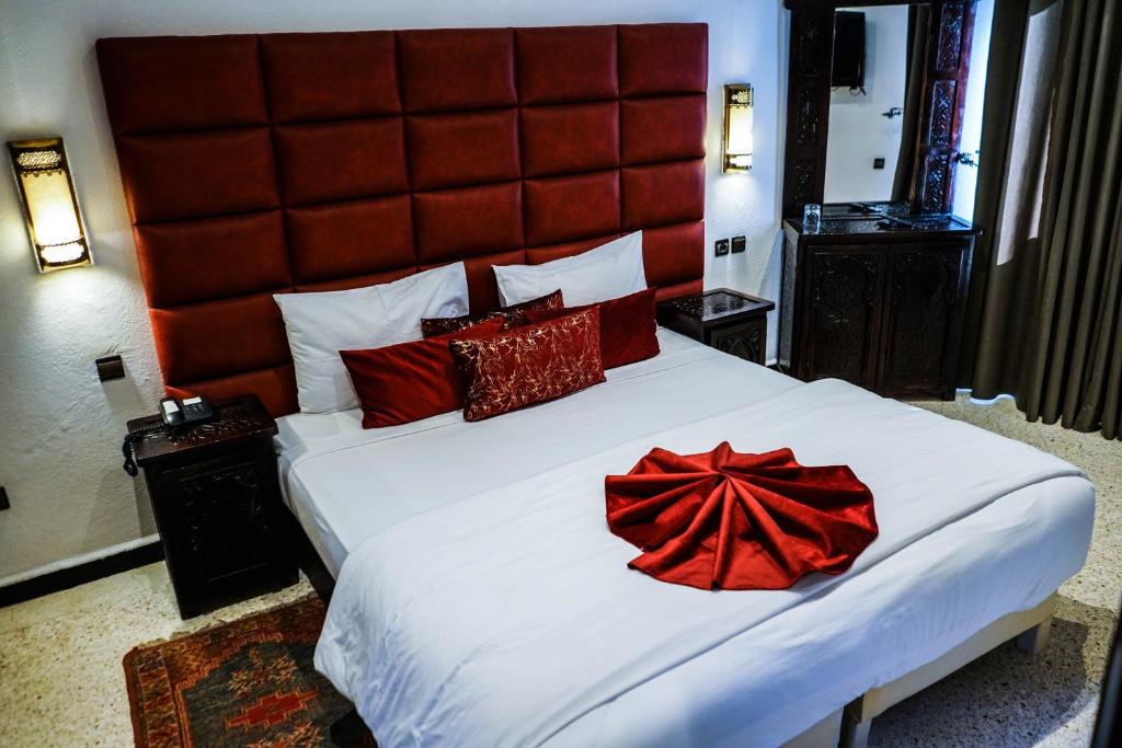 Postel nebo postele na pokoji v ubytování Hotel La Perle du Sud