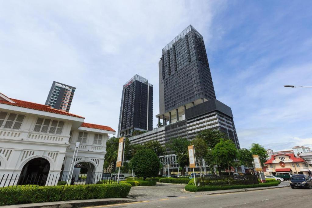 a tall building in the middle of a city at Tropicana 218 Macalister Sea & City View by stayCATion Homestay in George Town