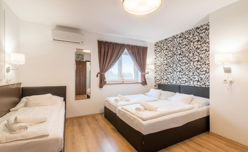 Postel nebo postele na pokoji v ubytování Autohof 171 Hotel Hegyeshalom