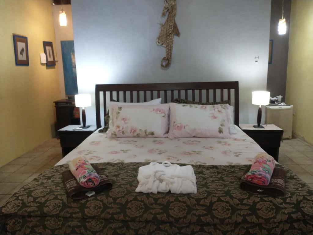 Ένα ή περισσότερα κρεβάτια σε δωμάτιο στο Sítio Maleleo