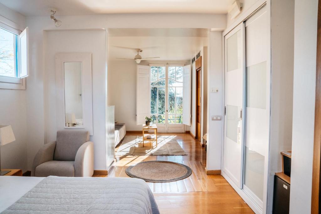 Postel nebo postele na pokoji v ubytování Hotel Boutique Mas Passamaner