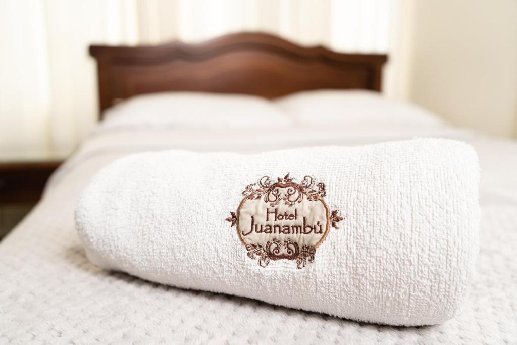 Postel nebo postele na pokoji v ubytování Hotel Juanambu