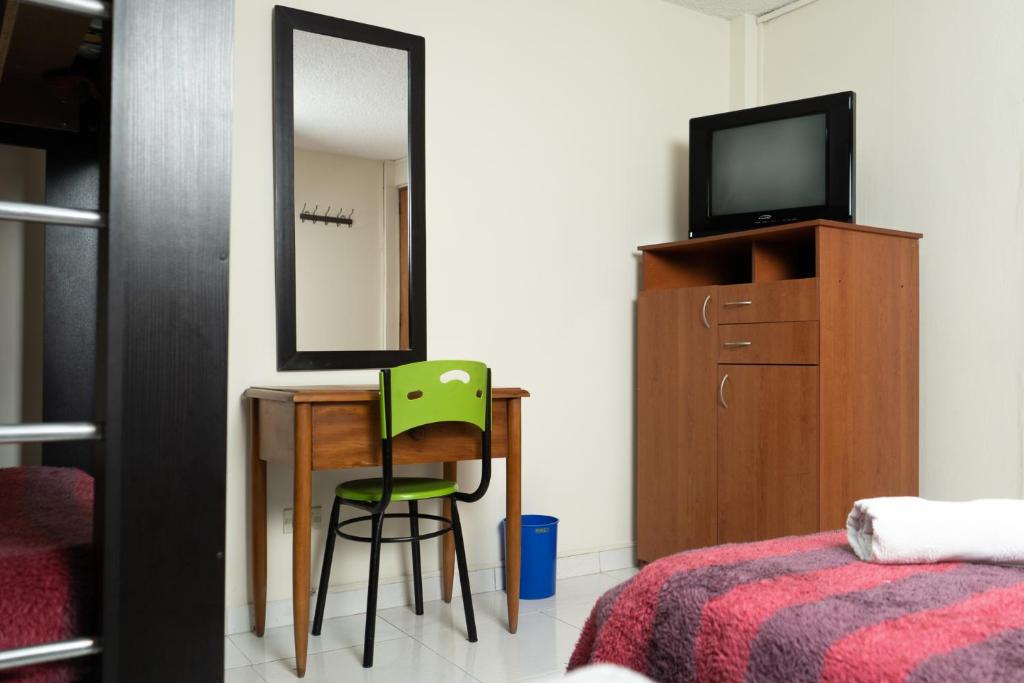TV a/nebo společenská místnost v ubytování Hotel Juanambu