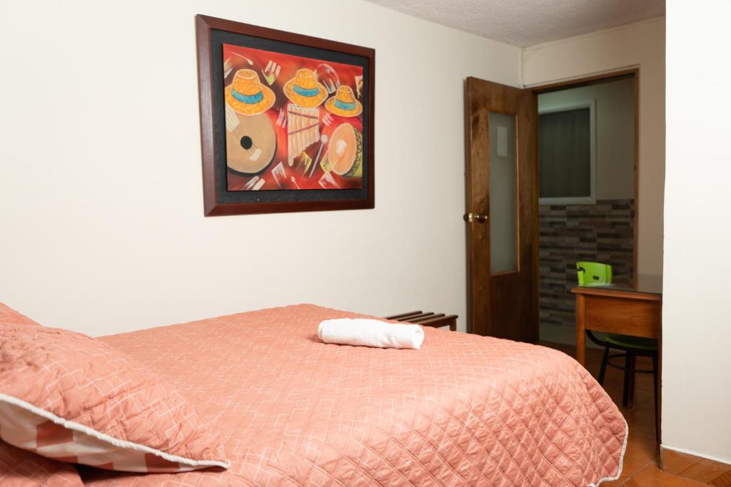 Postel nebo postele na pokoji v ubytování Hotel Juanambu