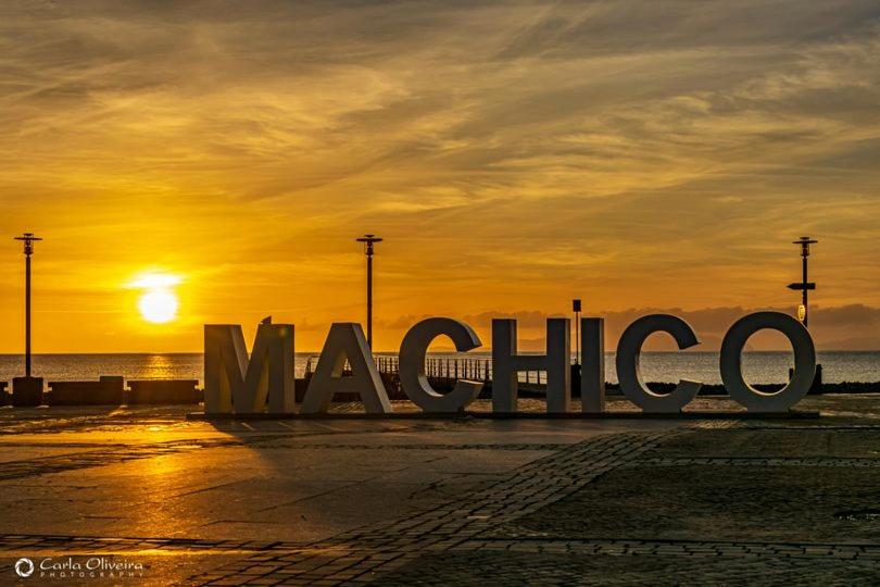 a large sign that says maricelli in front of a sunset at Opala Flats do Lago 4 in Machico