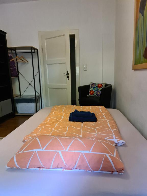 a large bed in a room with at Zimmer in zentraler Lage / Room near downtown in Würzburg