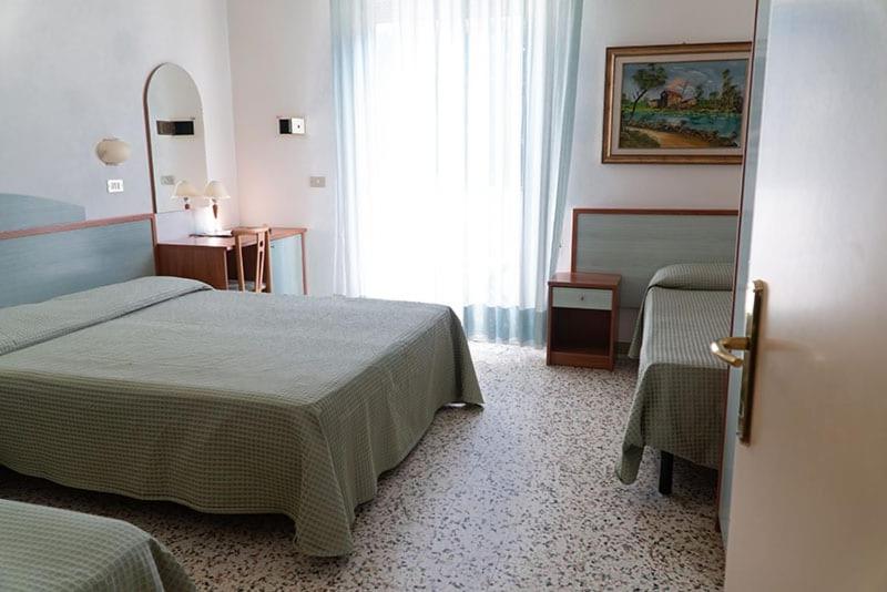 Postel nebo postele na pokoji v ubytování Hotel Cinzia
