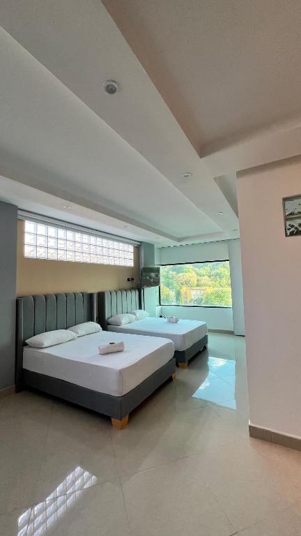 Letto o letti in una camera di Hotel Gran Conquistador 33