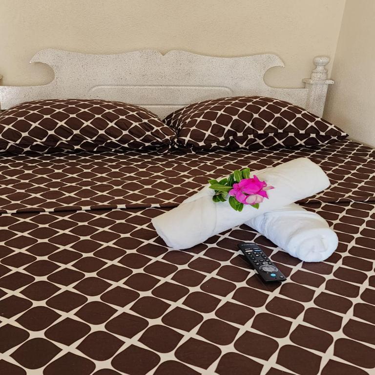 Postel nebo postele na pokoji v ubytování Rose Hideaway